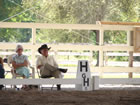 Carol Lavell and Tom Mikes looking on while Orintha is riding James.